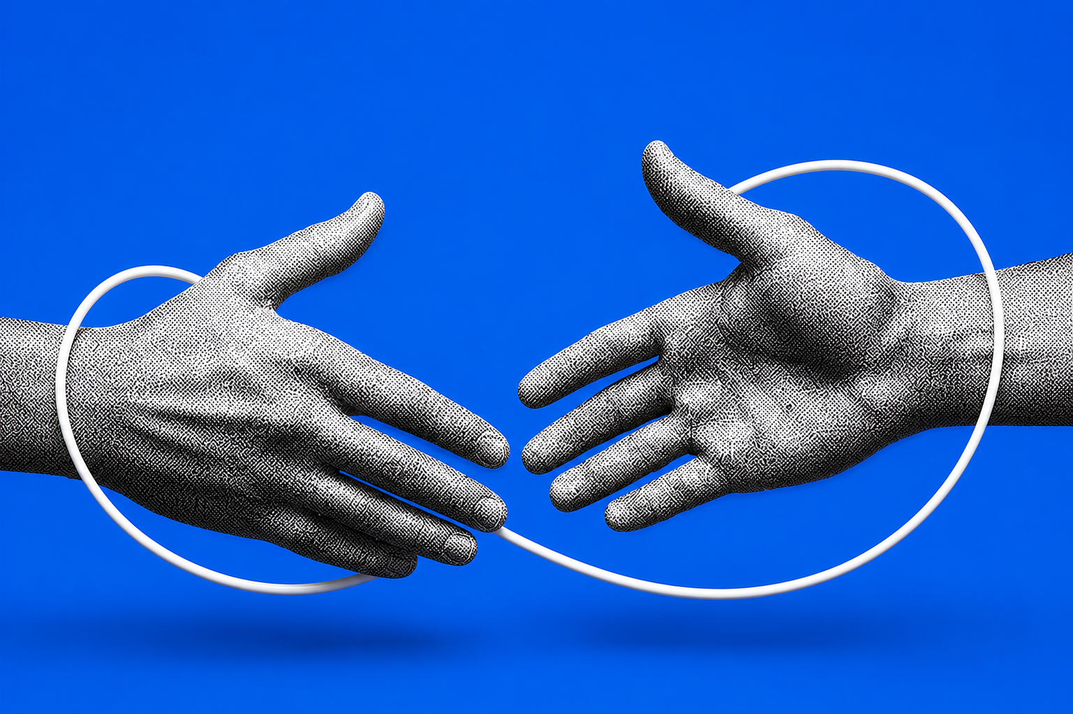 Two hands meeting in a handshake